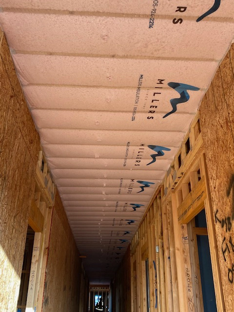 blown in insulation in a new construction hallway