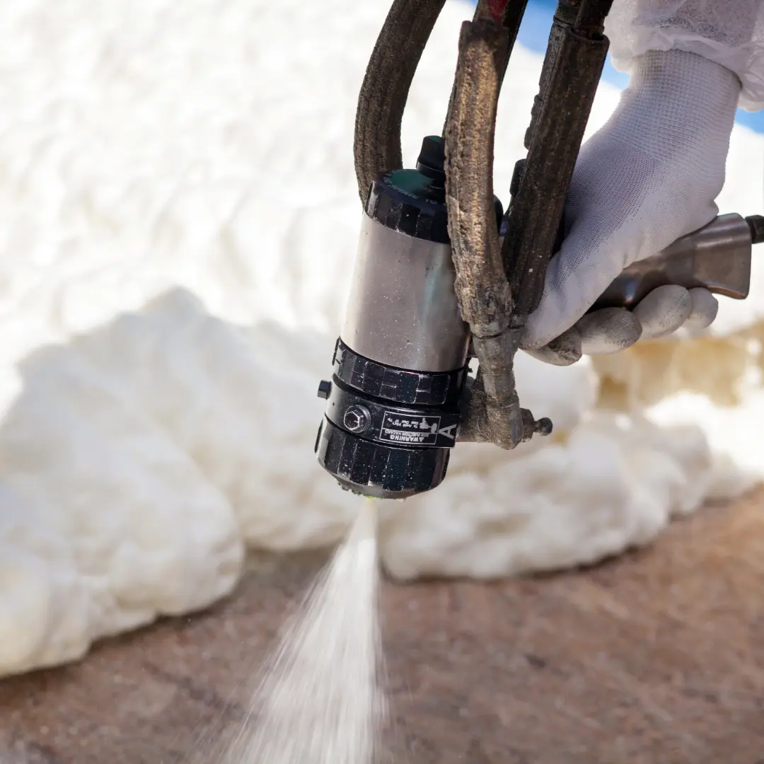 Spray foam insulation (1) Spray foam insulation coming from specialized sprayer.